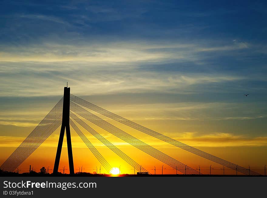 Sunset bridge river Daugava Riga