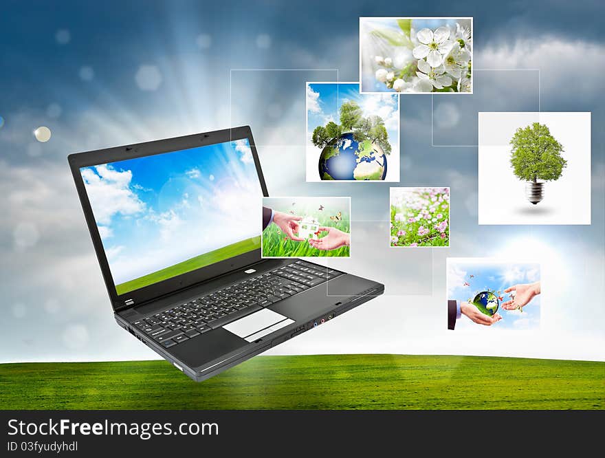 Colorful collage of laptop against green nature background. Colorful collage of laptop against green nature background