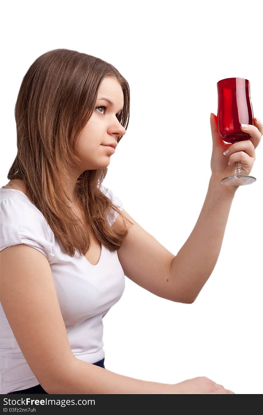 A girl in a bright red T-shirt and a glass sitting