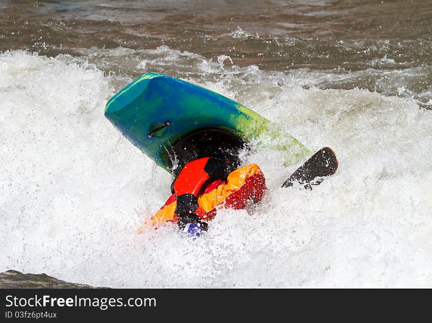 Kayaker making loop, freestyle kayak competition