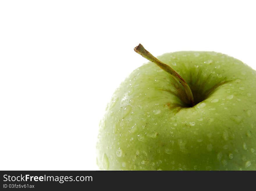 Detail photo of green apple isolated on white background, water drops