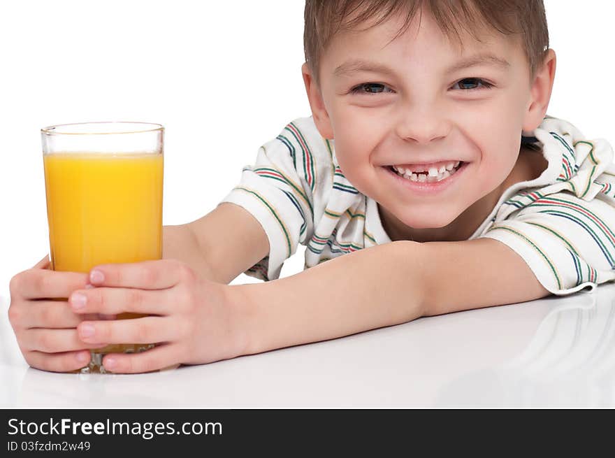 Little boy having a glass of refreshing oranges juice - isolated on white. Little boy having a glass of refreshing oranges juice - isolated on white