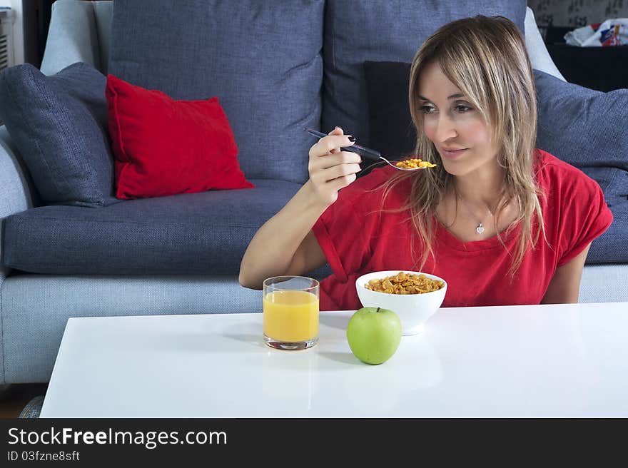 Beautiful blond woman having a healthy breakfast. Beautiful blond woman having a healthy breakfast