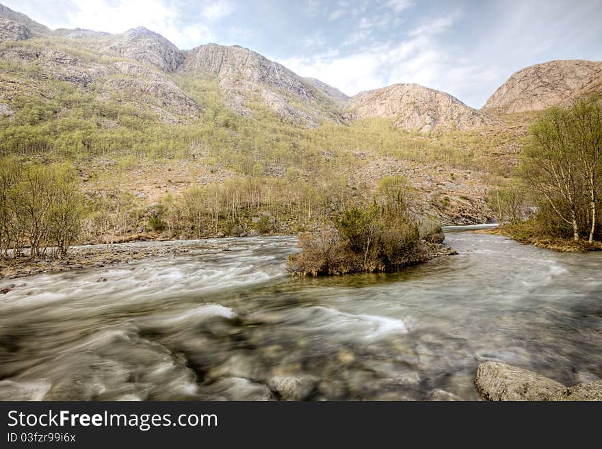 Wide angle view over a Norwegian river in southern Norway. Wide angle view over a Norwegian river in southern Norway