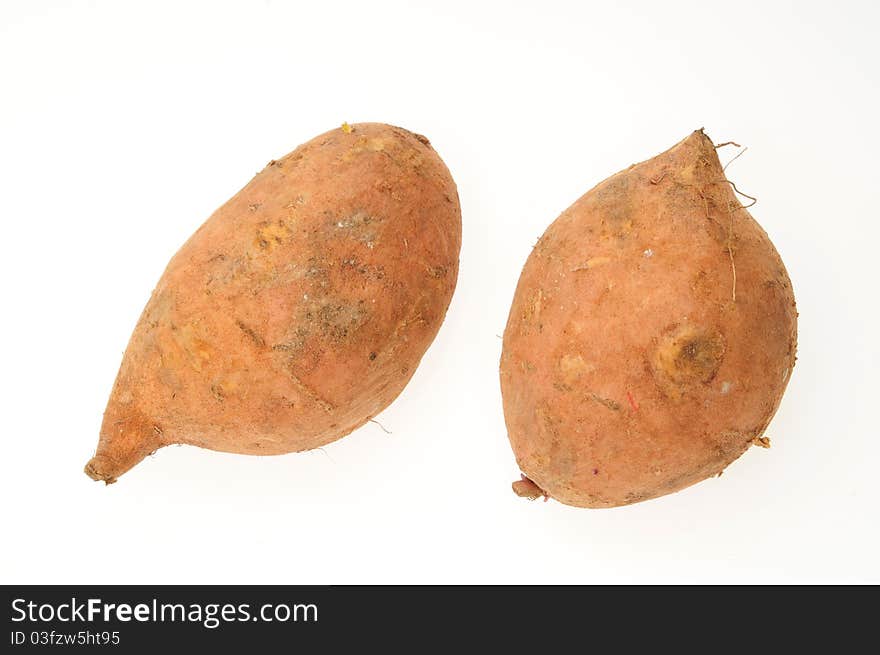 Closeup Of Sweet Potatoes Isolated On White Background