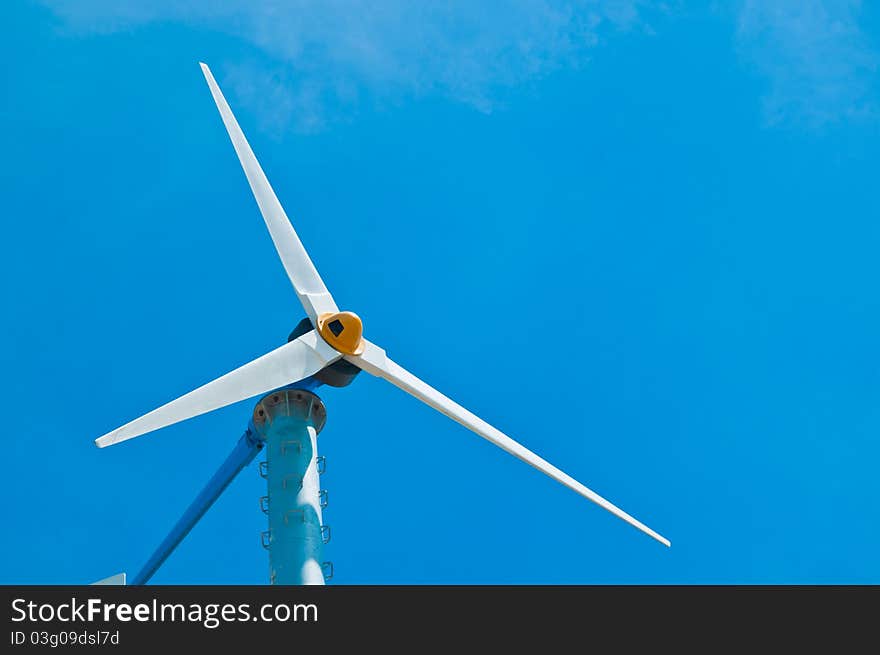 Wind turbine in blue sky