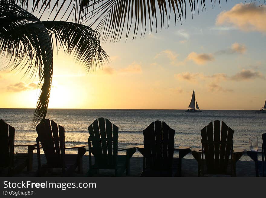 A sailboat in the horizon during the sunset. A sailboat in the horizon during the sunset