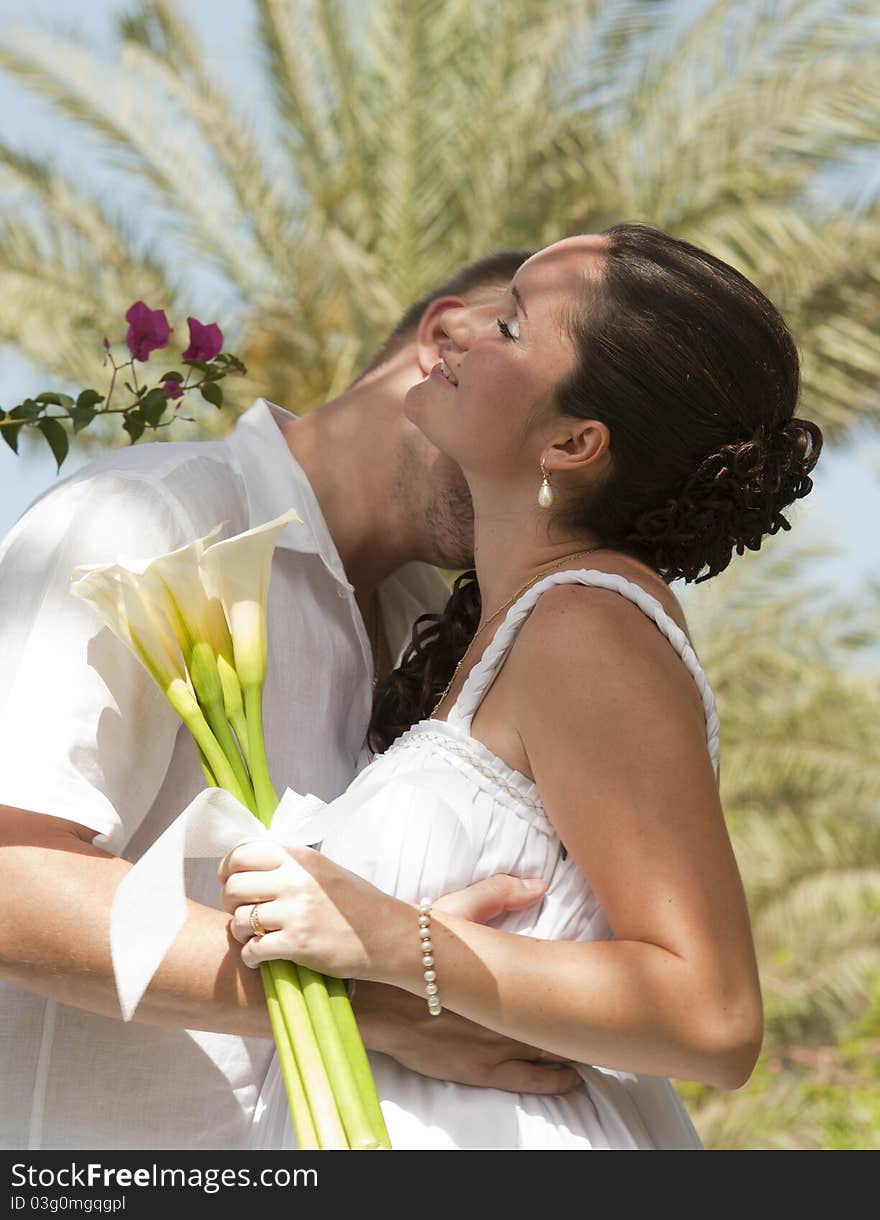 Newlyweds having a romantic kiss