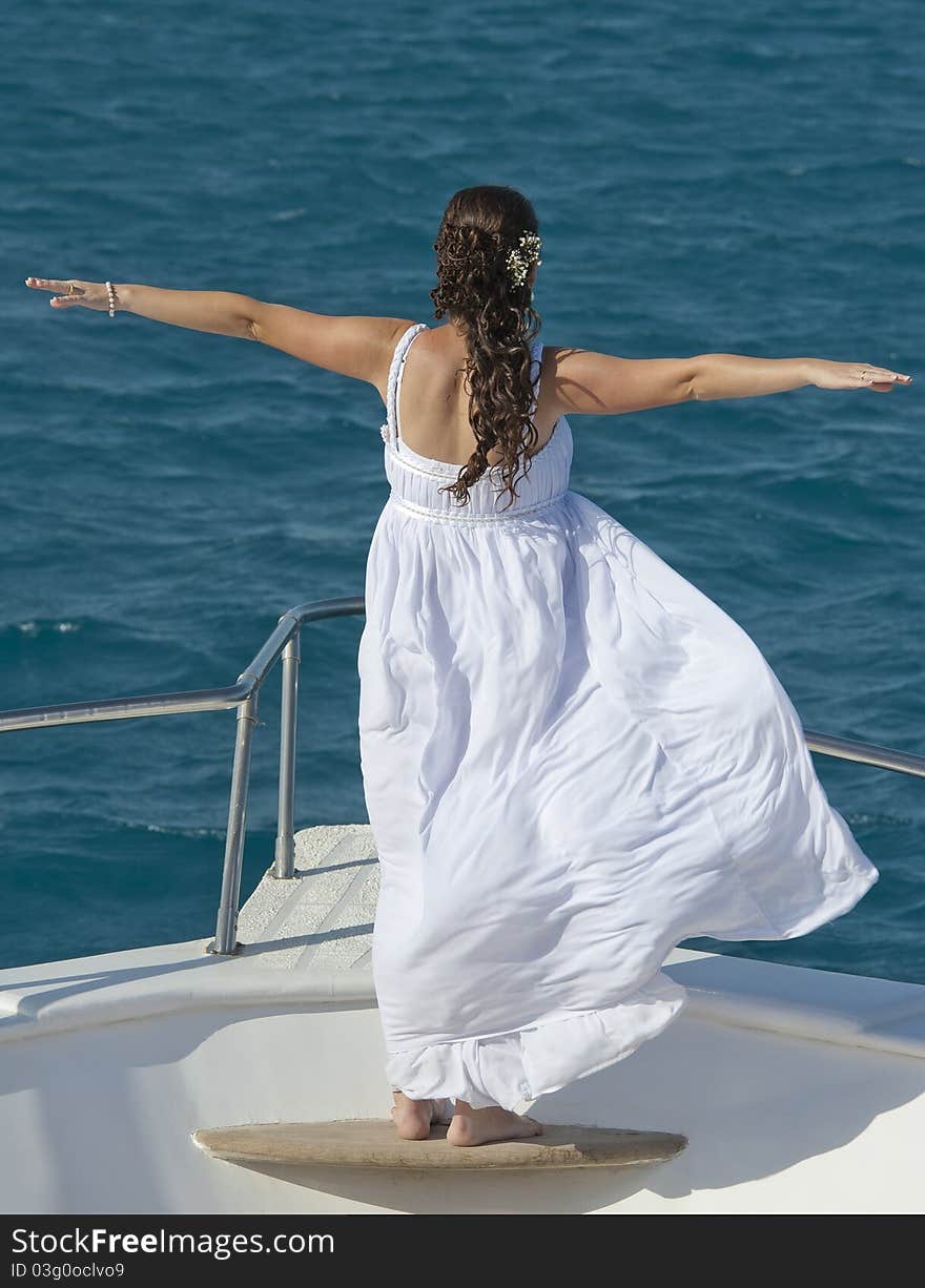 Bride on the bow of a boat