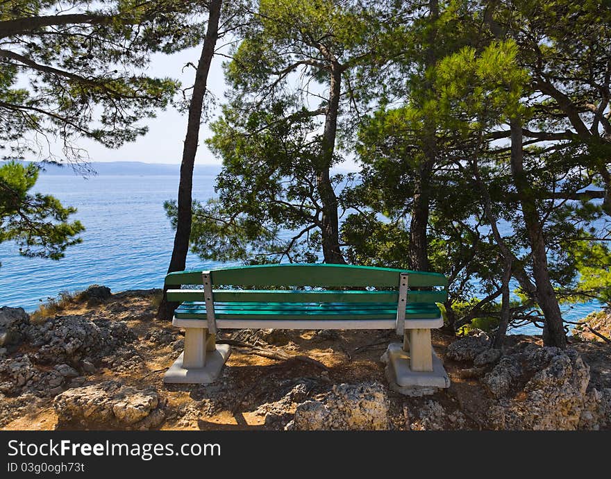 Coast, bench and sea at Brela, Croatia