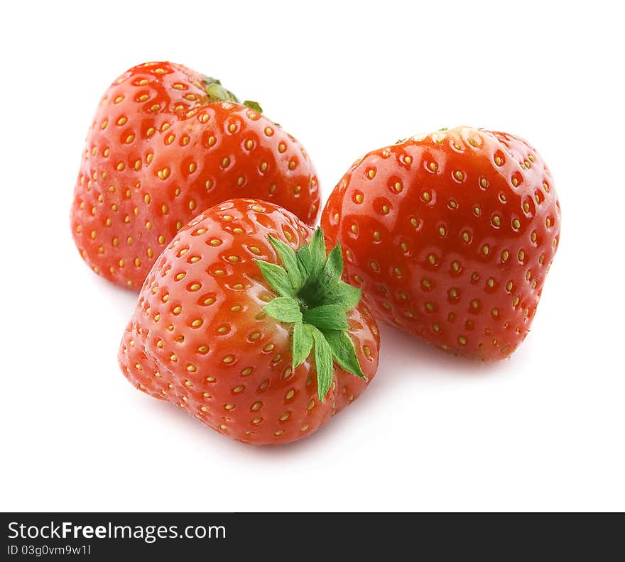 Three fresh red strawberries on the white. Three fresh red strawberries on the white