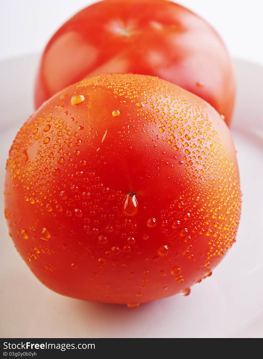 Tomatos On A White Background