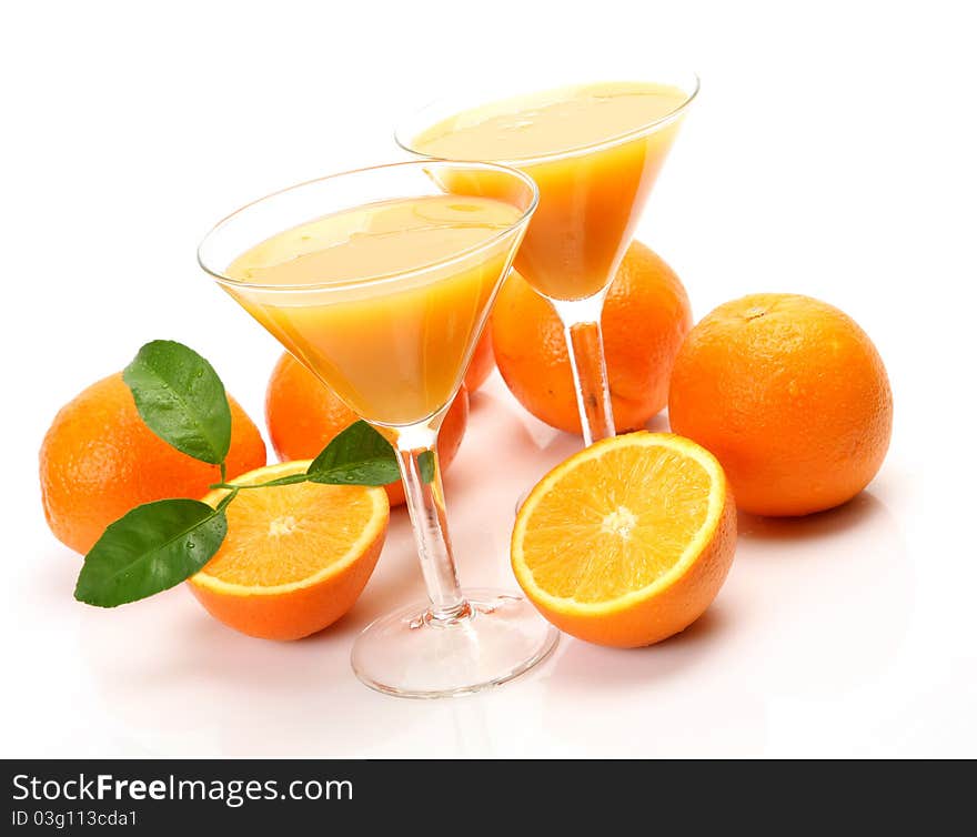 Fresh fruit and juice on a white background