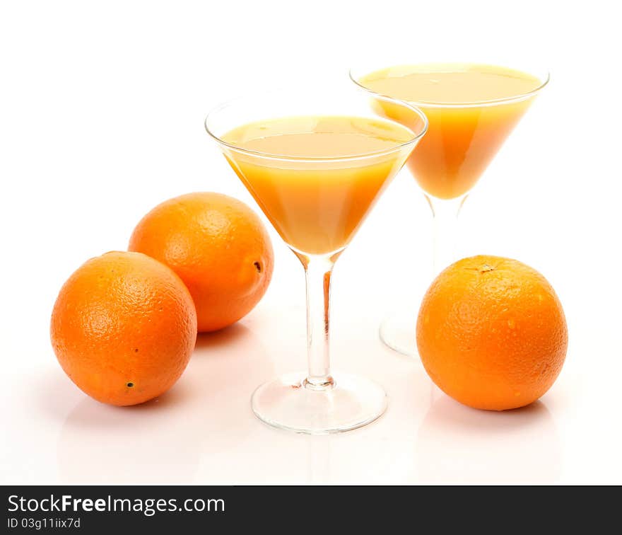 Fresh fruit and juice on a white background