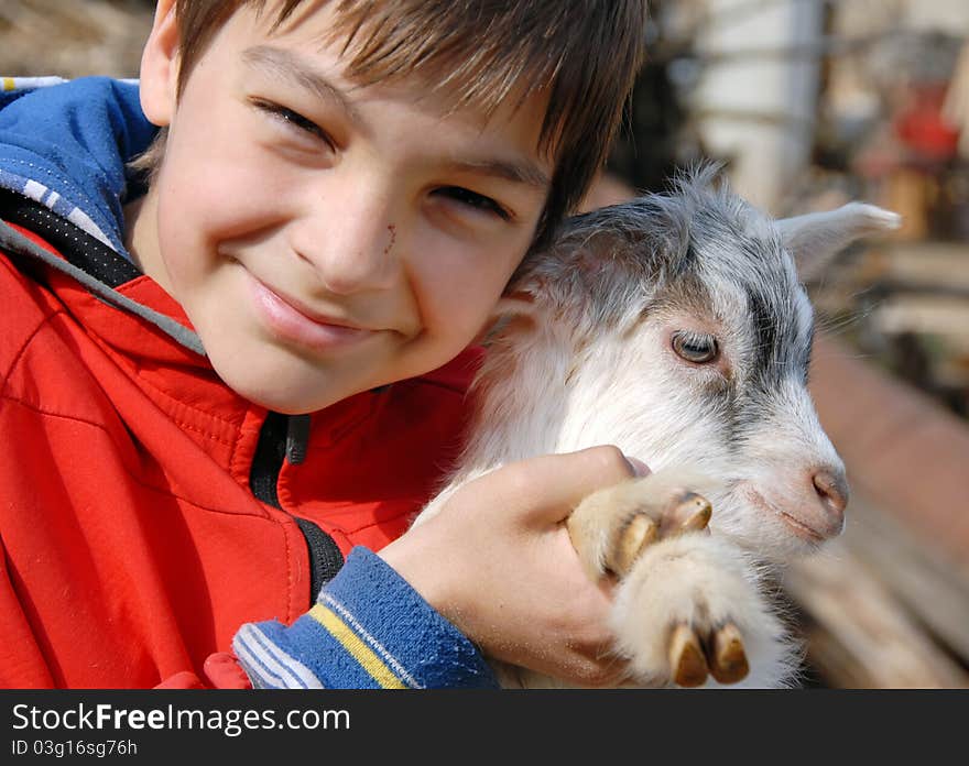 Teenage Boy With Goatling