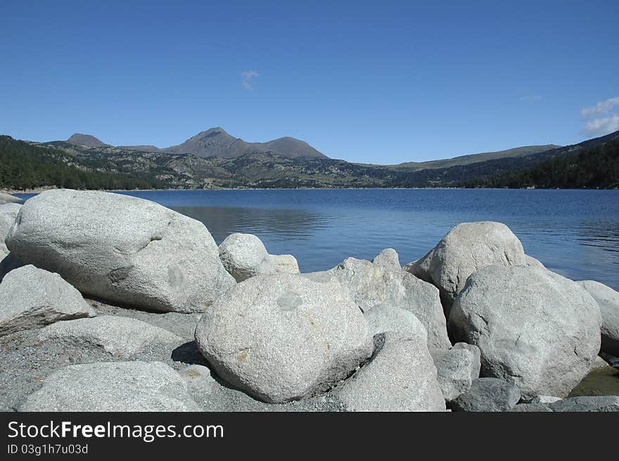 Landscape Lake Mountain with white rocks front