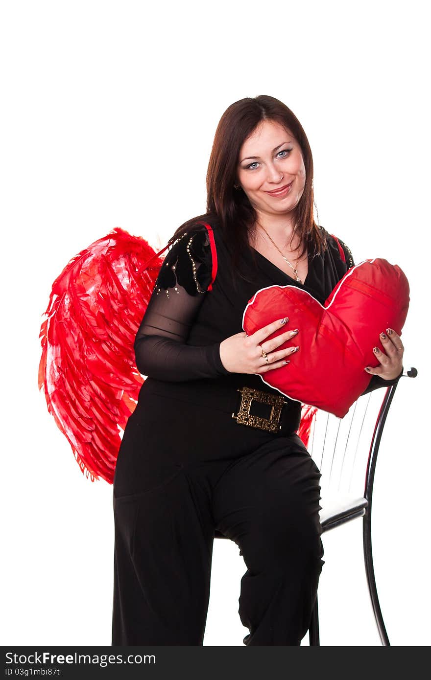 Beautiful woman with red heart in red angel wings isolated on white