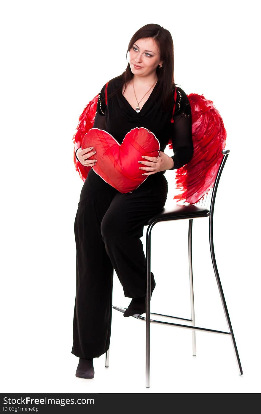 Beautiful woman with red heart in red angel wings isolated on white