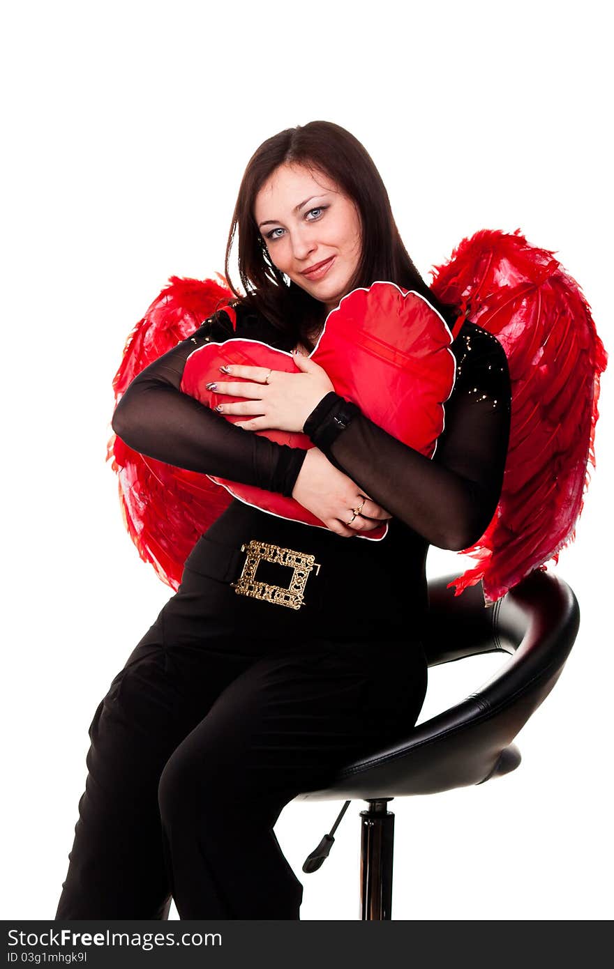 Beautiful woman with red heart in red angel wings isolated on white