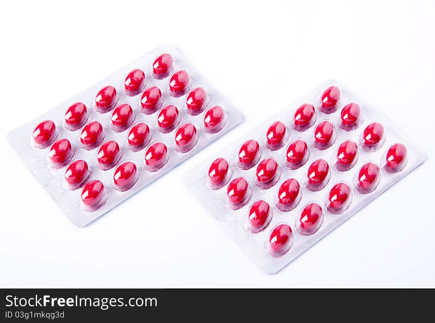 Packaging of medicine capsules red on white background. Packaging of medicine capsules red on white background