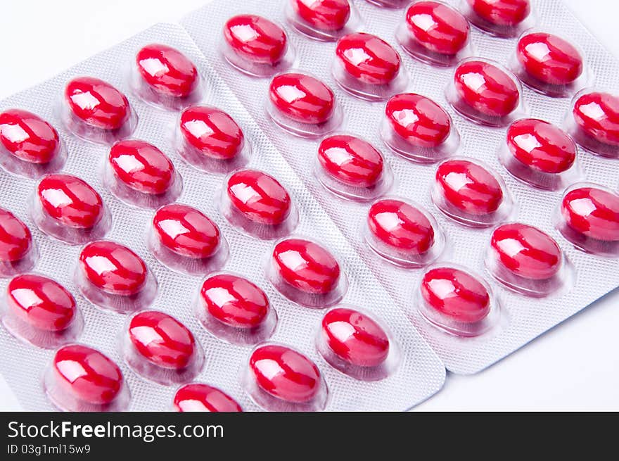 Packaging of medicine capsules red on white background. Packaging of medicine capsules red on white background