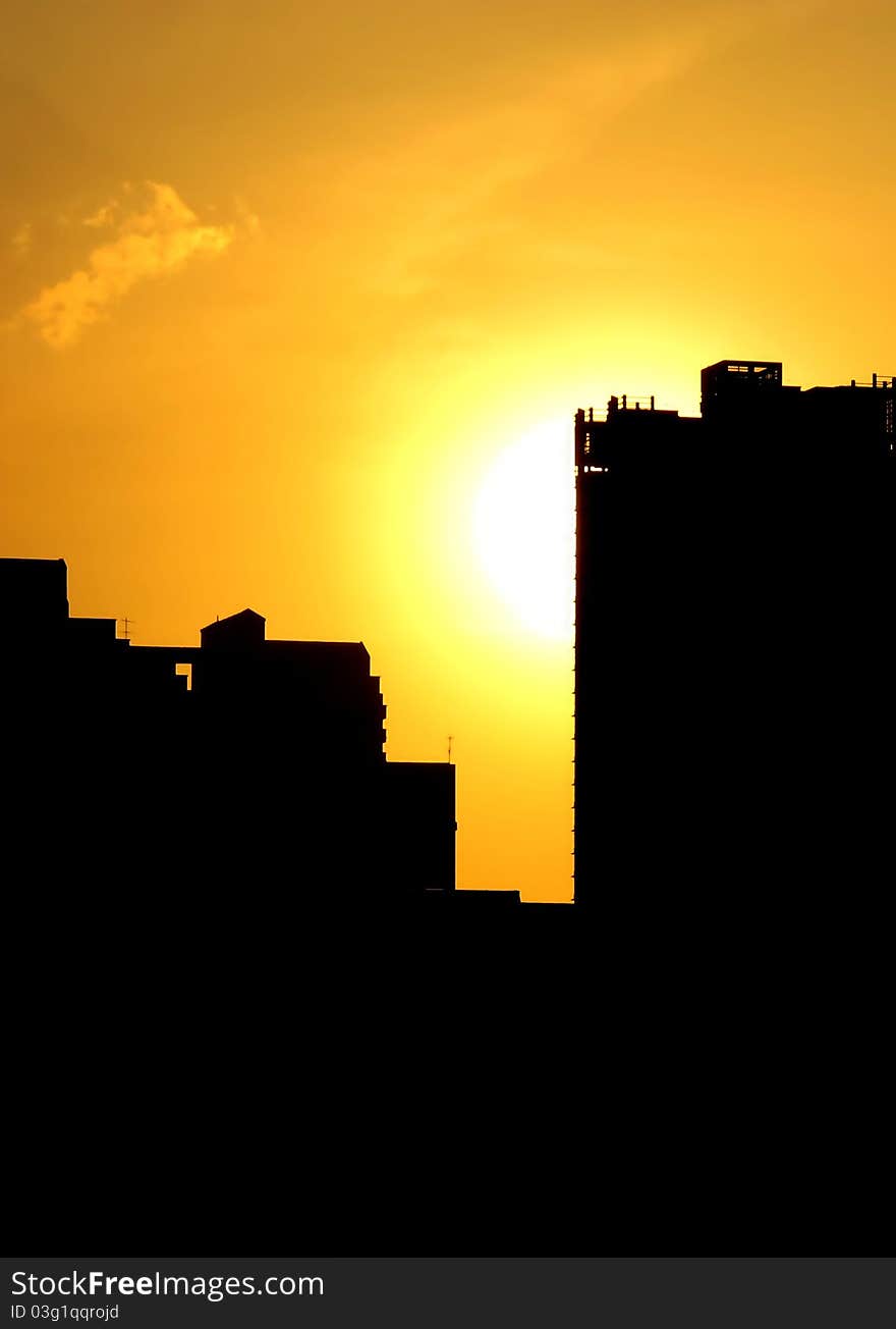 Summer Sunset With Silhouette Of Buildings