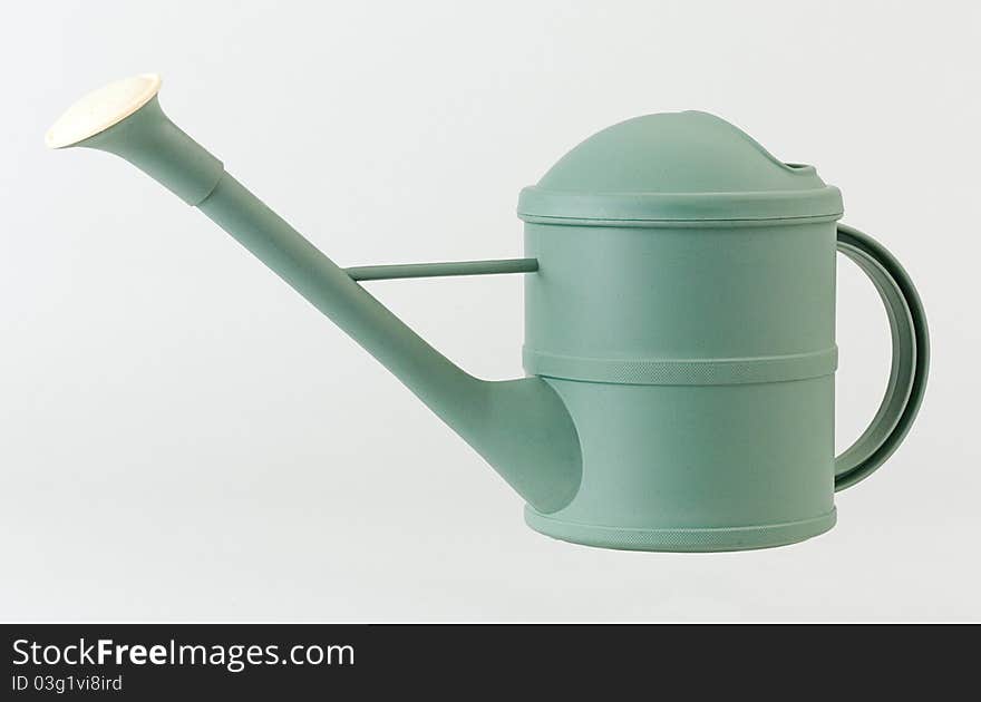 Nice green watering can good for your gardening an image isolated. Nice green watering can good for your gardening an image isolated