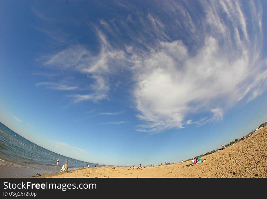 Golden beach and breathtaking sky with gorgeous clouds on a sunny day in Normandy, France. Golden beach and breathtaking sky with gorgeous clouds on a sunny day in Normandy, France