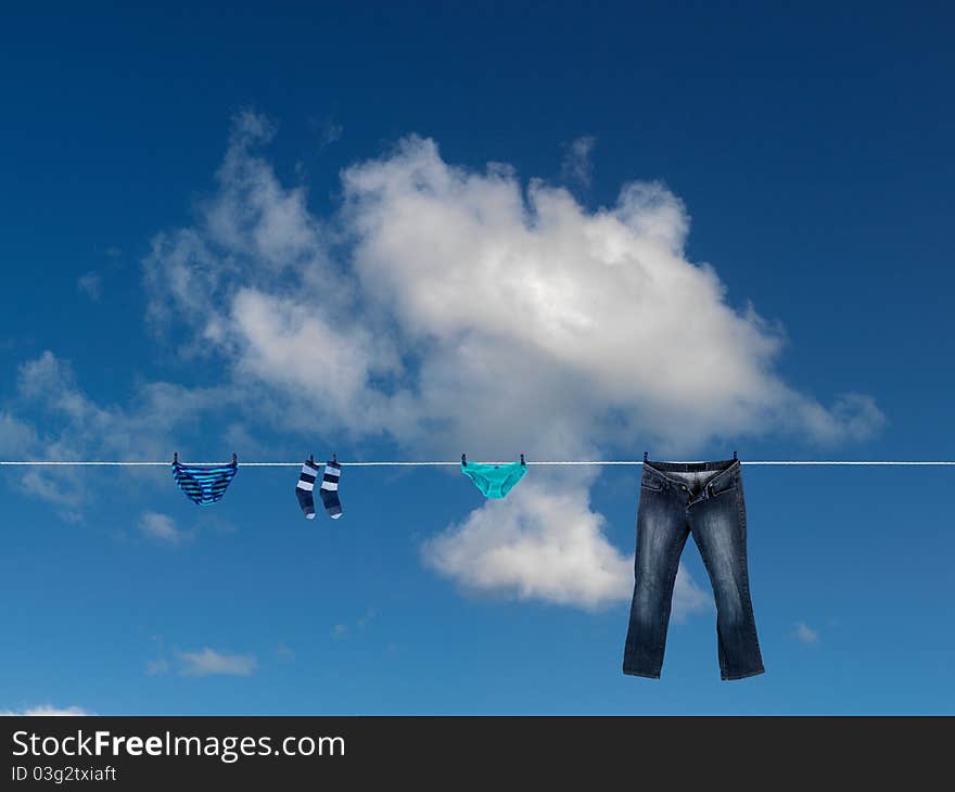 Clothes on a clothes line against a blue sky