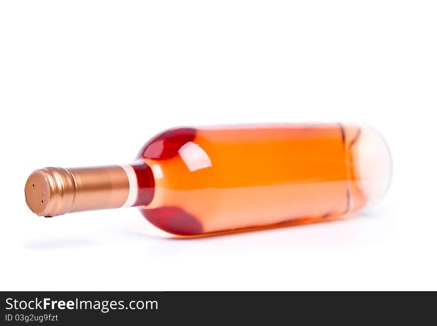 Rose wine in unmarked bottle (shallow DOF). Rose wine in unmarked bottle (shallow DOF)