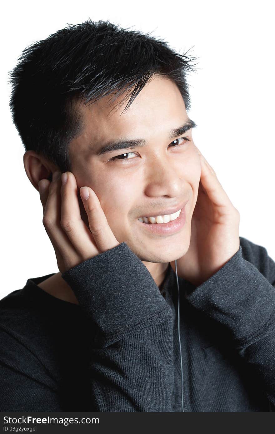 Man listening on earbud headphones