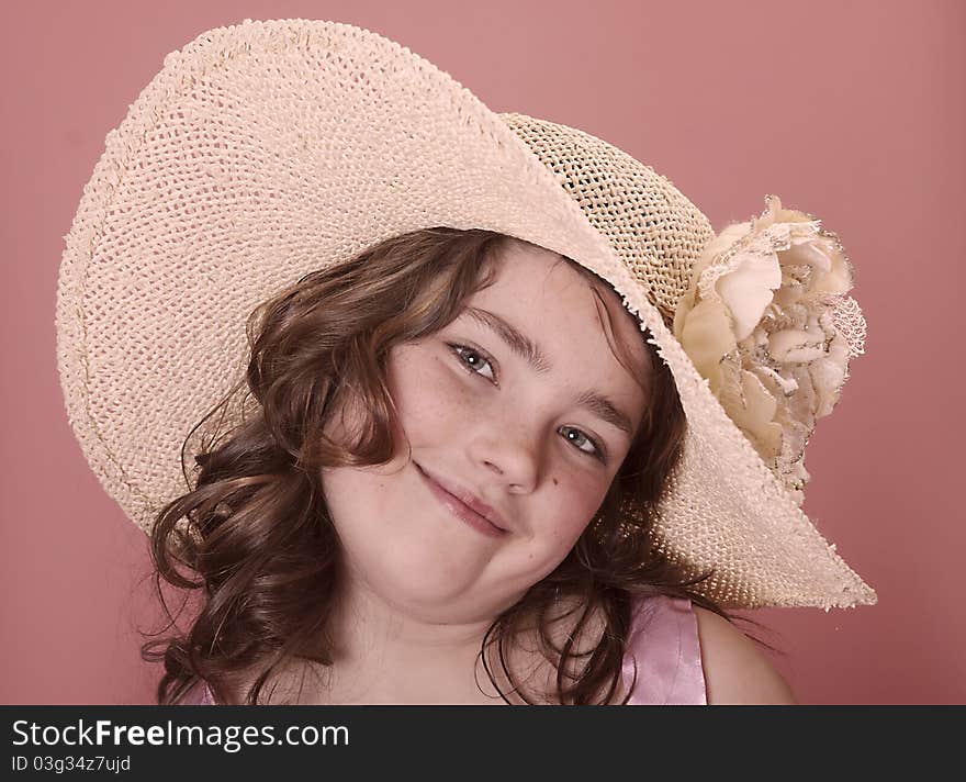 Young girl wearing a large brimmed souther hat. Young girl wearing a large brimmed souther hat.