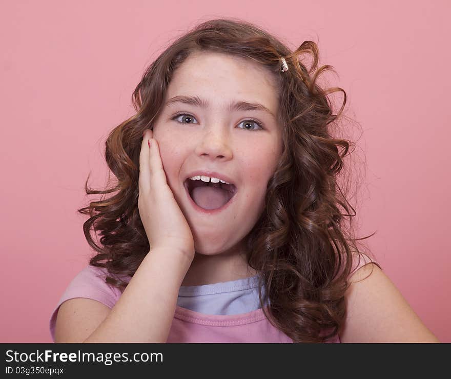 Pretty young preteen with surprised expression on her face. Pretty young preteen with surprised expression on her face.