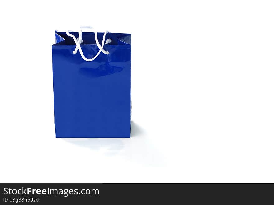 Blue paper bag isolated on white background