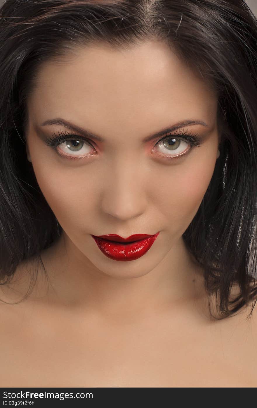 Portrait of beautiful brunette girl with beautiful red lips. Portrait of beautiful brunette girl with beautiful red lips