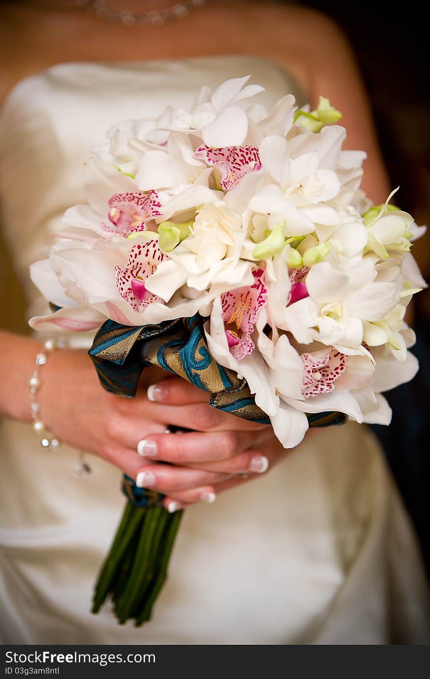 A bride holding her wedding bouquet