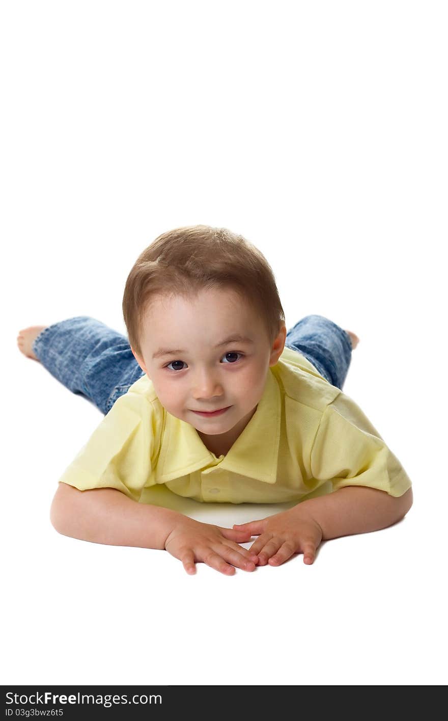 Cute boy lying on floor isolated over white