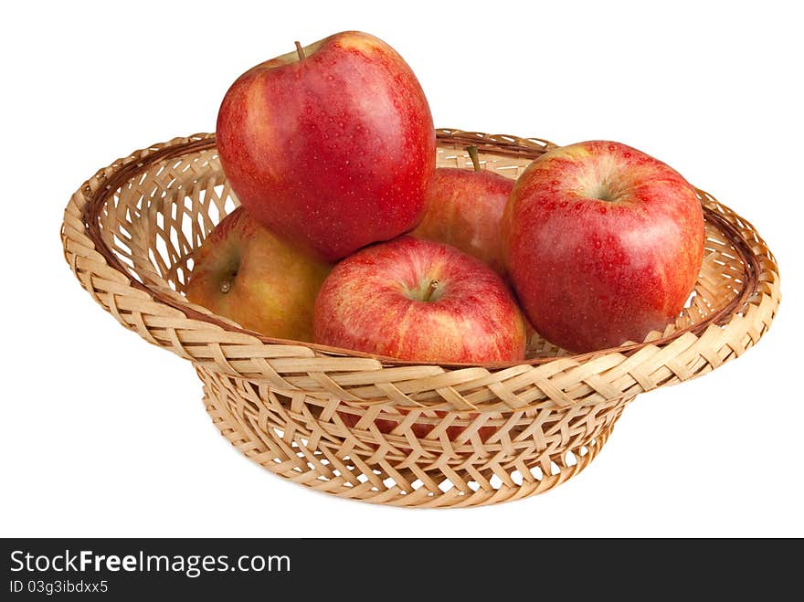 Basket with apples isolated on a white background