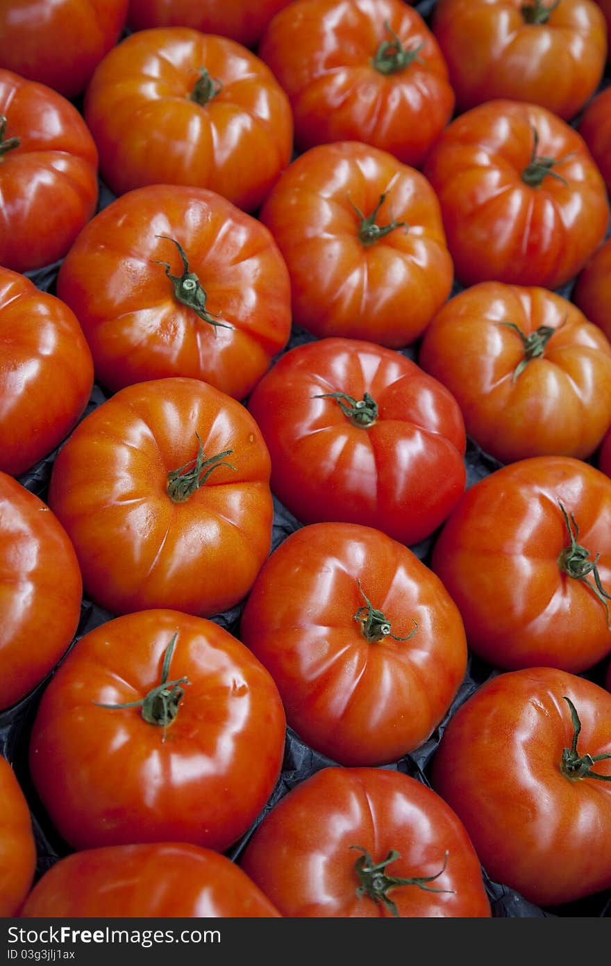 Close up of Tomatoes for sale on Market Stall. Close up of Tomatoes for sale on Market Stall