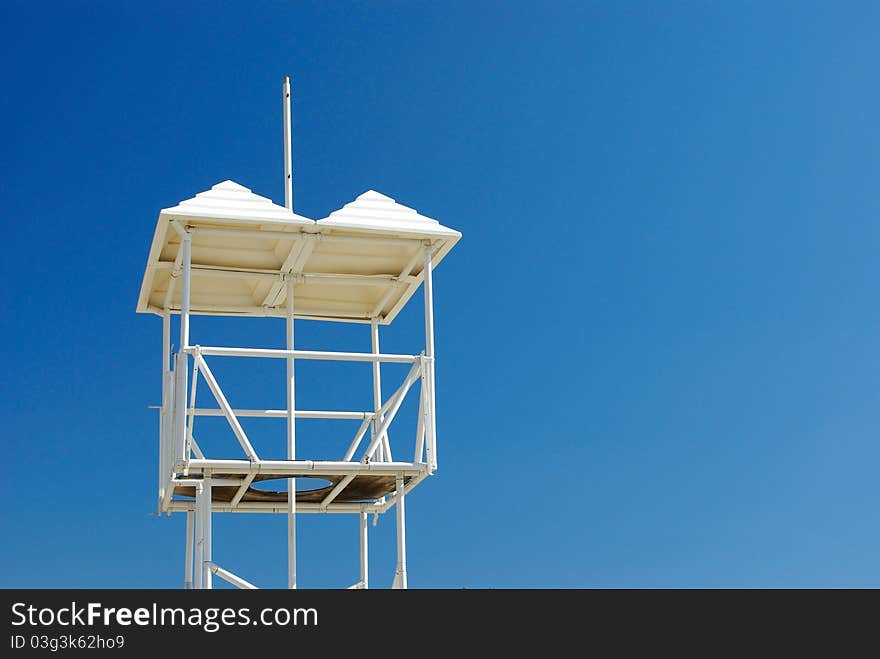 A lifeguard watchtower against sky background. A lifeguard watchtower against sky background