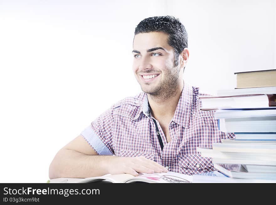 Student smiling with books on white background