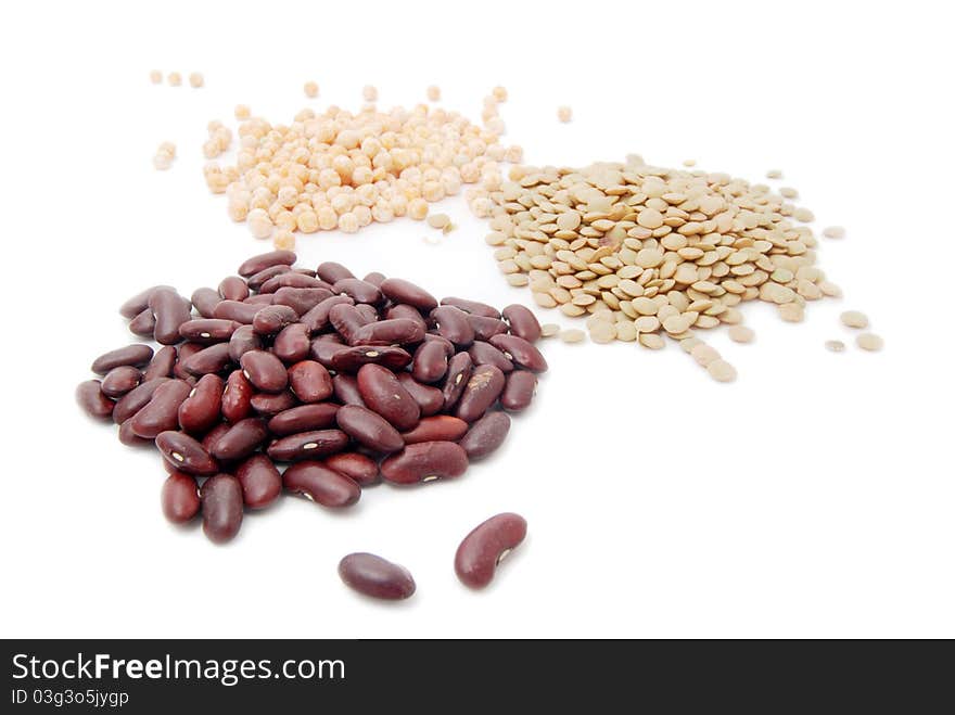 Red haricot, lentil and peas isolated on white