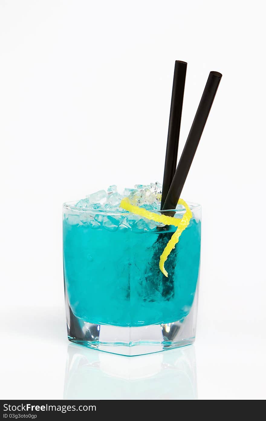 Photo of refreshing blue alcohol cocktail on crushed ice. Photo of refreshing blue alcohol cocktail on crushed ice