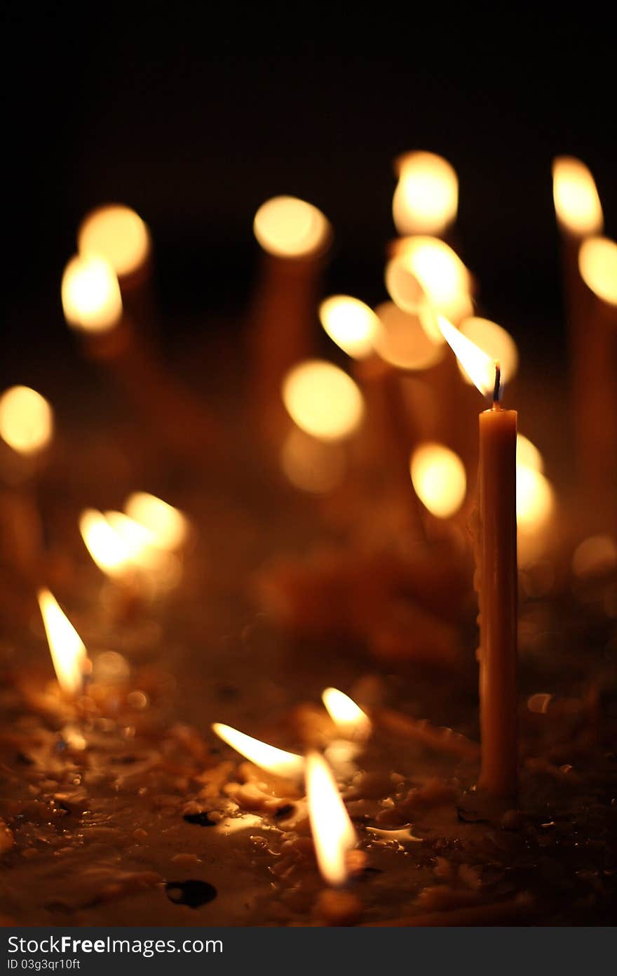 Church prayer candles in the dark