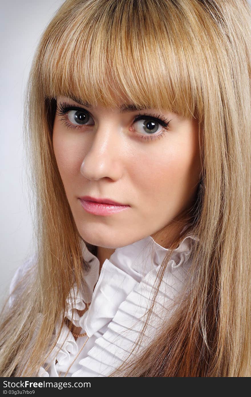 Portrait of blond sexy woman in suit close-up