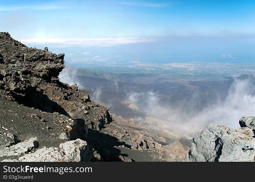 Panoramic view from mount Etna with sea and towns beneath, Sicily, Italy