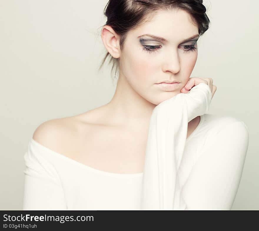 Portrait of a young woman on a white background. Portrait of a young woman on a white background.