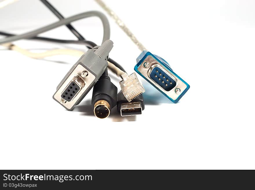 Five computer cables on white background