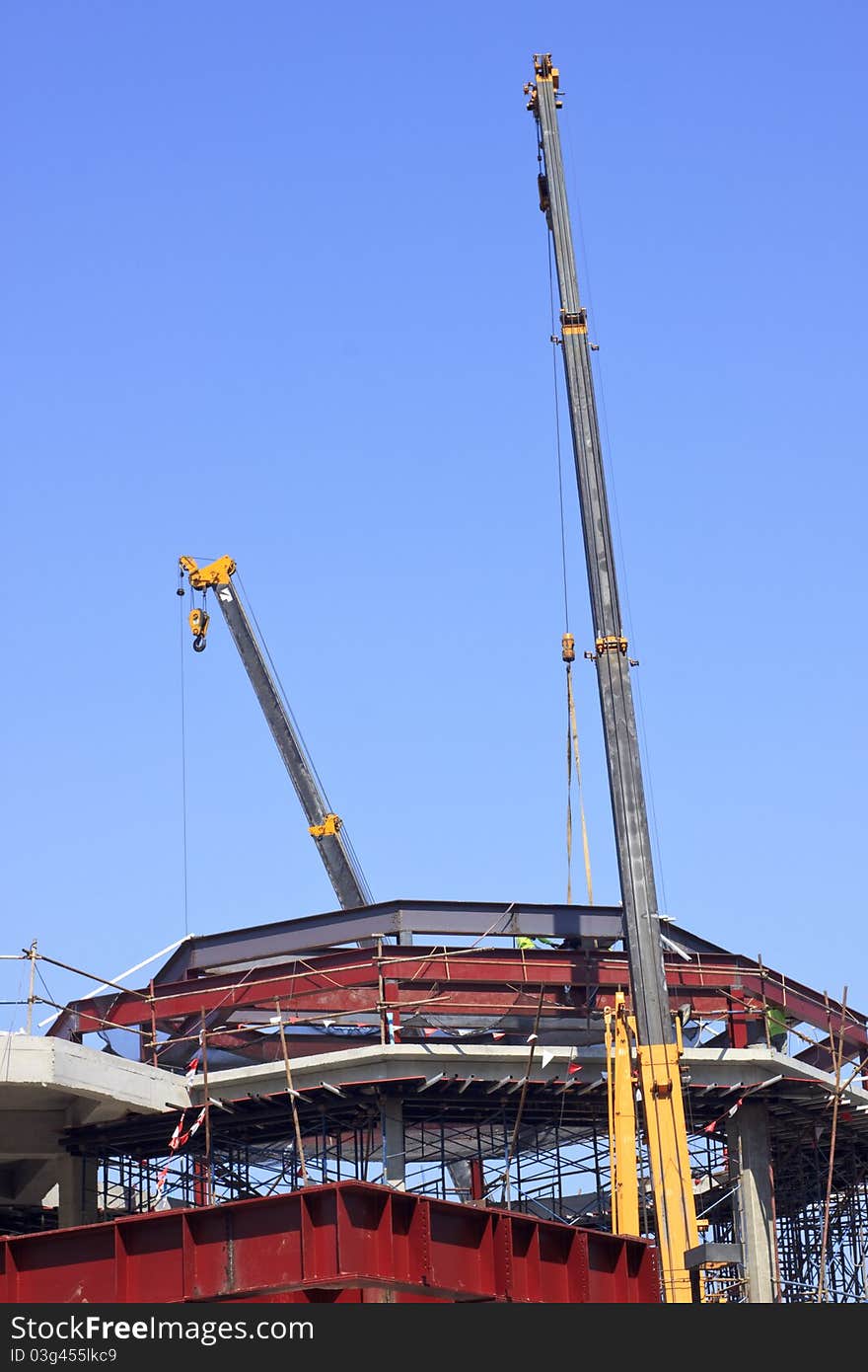 Crane in construction side blue sky day