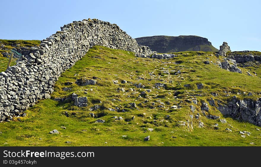 English countryside landscape: hill, drywall fence